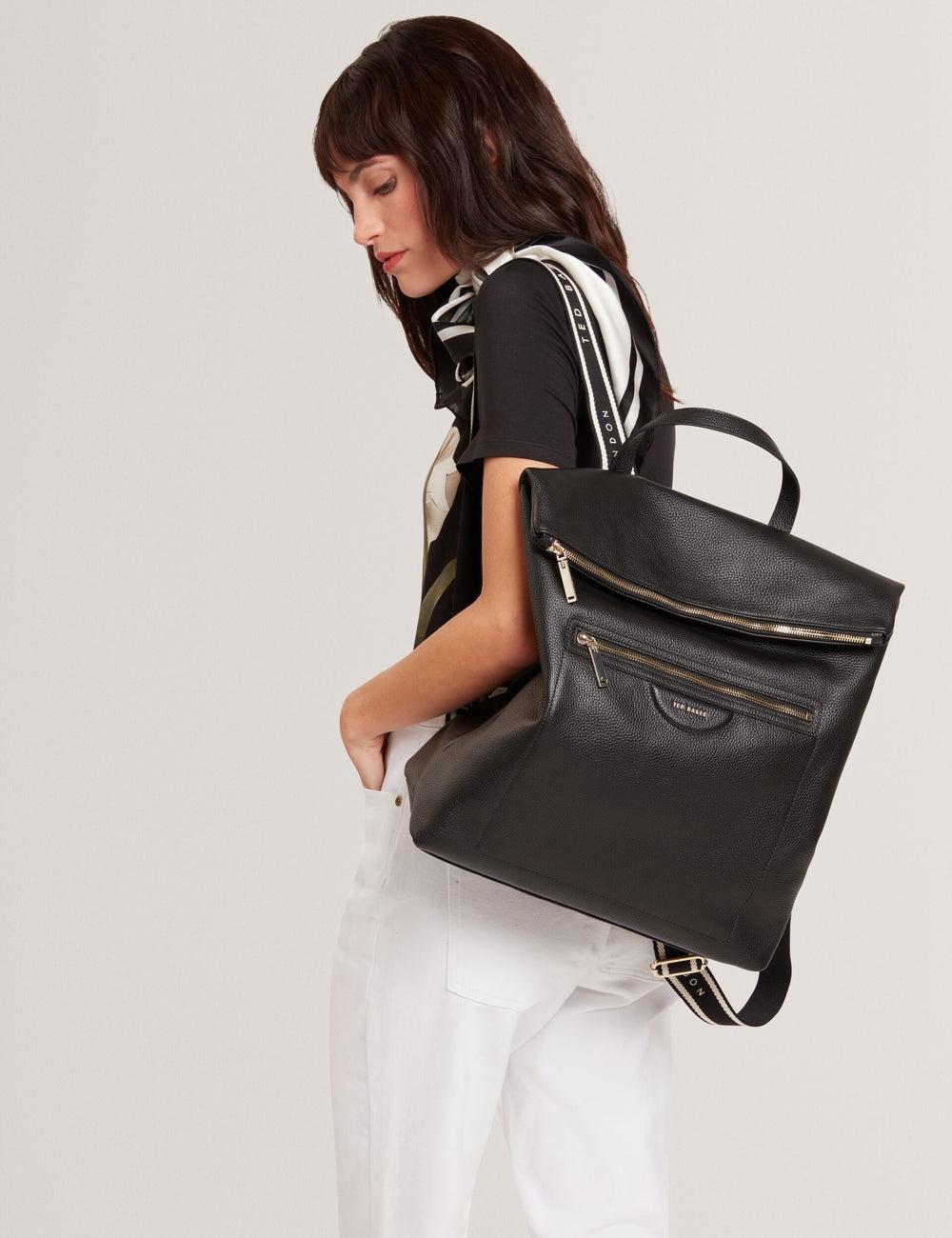 Women Ted Baker ESSAYA - Leather Webbing Strap Fold Over Backpacks Black | HUZV05934